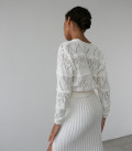 Suit with openwork cardigan with buttons and a pleated skirt with a slit milk