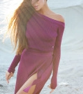 A suit with top an asymmetric neck and a scented skirt plum