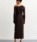 A suit with top an asymmetric neck and a scented skirt chocolate