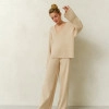Costume Windy-Fly with jumper and flared trousers cream