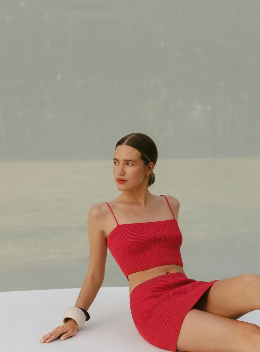 A set of a bandeau top and a mini skirt with an imitation of a basque Leymon red