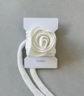 A rose on a scarf milk